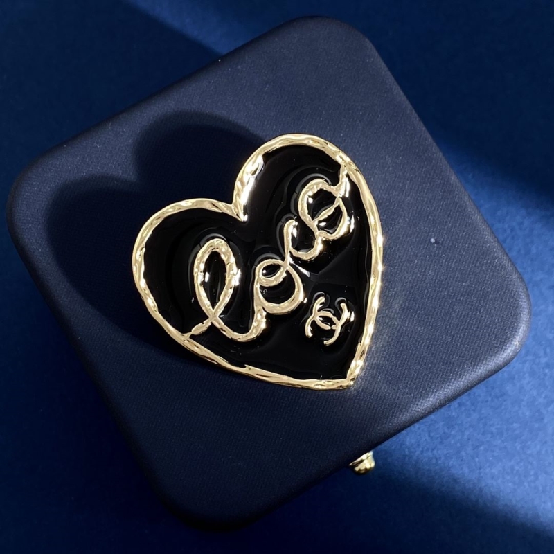 Ch*el brooches
